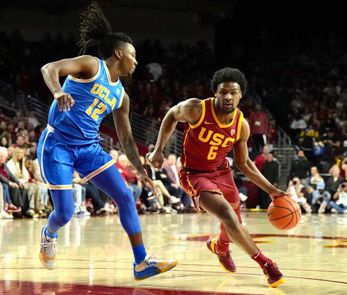 Bronny James drives against a UCLA defender.